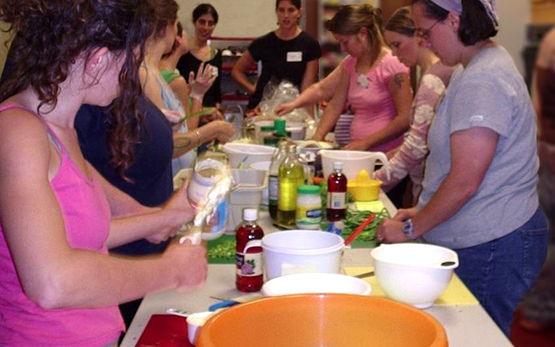 Nutrition Program Educator Myra McKinney (center) leads a hands-on cooking class at CCE-Tompkins (2007)
