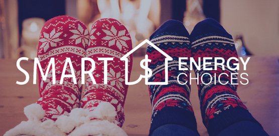 two pairs of feet wearing colorful socks, before a fireplace