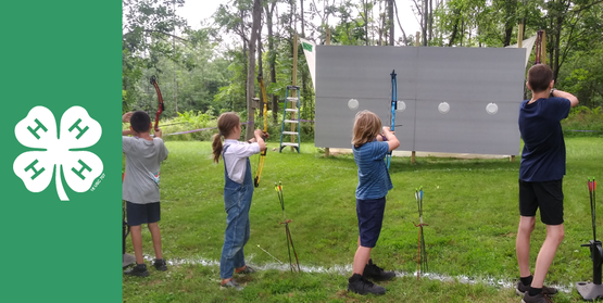 children performing archery