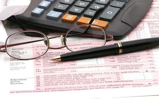 tax return, eye glasses, calculator