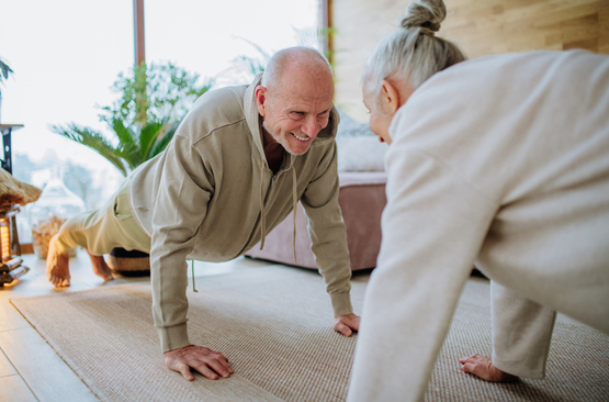 senior couple doing pushups