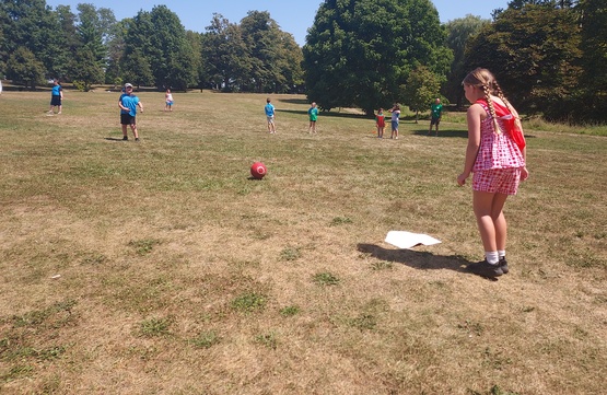 Campers playing a fun game of kickball.