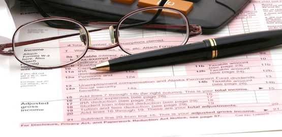 tax return, eye glasses, calculator