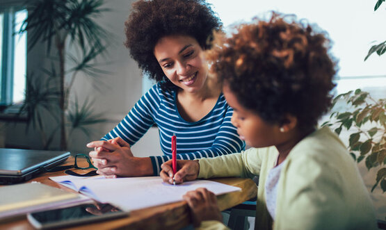 School Year Success (For parents/caregivers of youth ages 4-18) via Zoom parent helping child with homework