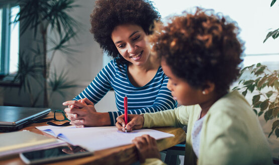 parent helping child with homework