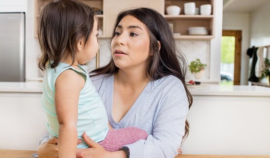 mom talking toddler through tantrum