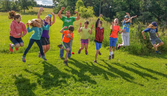 Kids jumping at Farm Day Camp