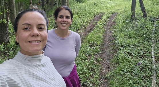 Cecilia Reyes and Mildred Alvarado on their land at CASA in Danby, NY 
