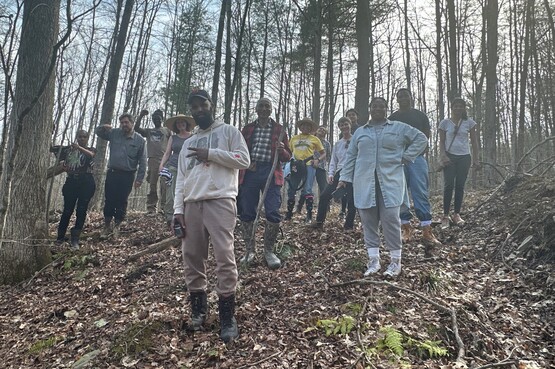  
Taili Mugambee, Antonisha Owens, Yao Foli, Omar Stoute, Leon Holden, Marilu Lopez Fretts with friends on their shared land in Candor, NY.