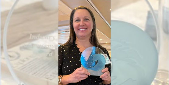 Fisheries Specialist Kristin Gerbino holding her Discover LI Industry Advancement Award for the Long Island Seafood Cuisine Trail