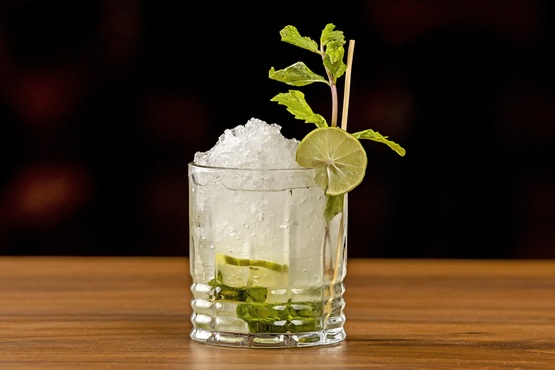 A mocktail with lime and herbs.