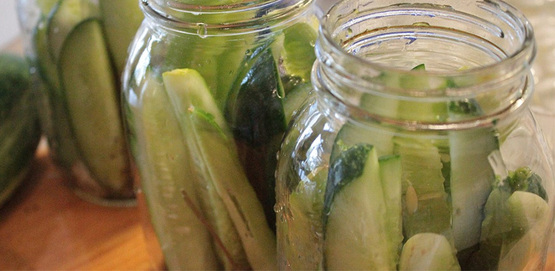 cucumbers in canning jars, about to become pickles