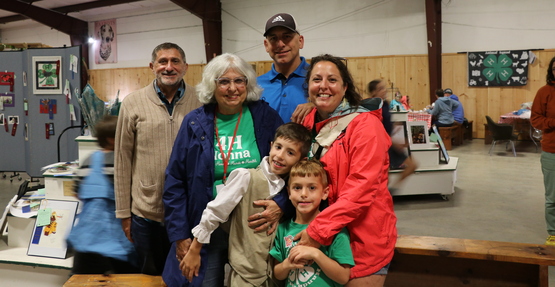 A multi-generational 4-H family poses after Public Presentations at the 2025 Ulster County Fair.