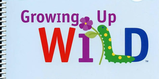 grass and sky with text that says growing up wild the L in wild is a caterpillar