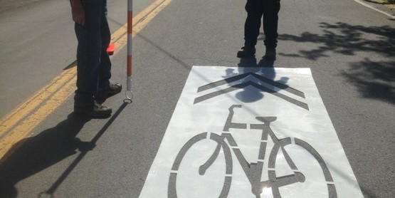 Painting sharrows on Delaware Avenue in Kingston