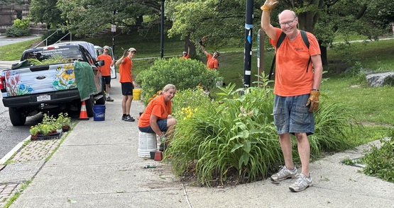 Volunteers and staff working at the Dryden Road garden in Collegetown