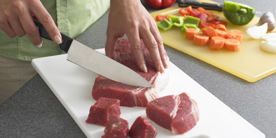 After cutting raw meats, wash cutting board, utensils, and countertops with hot, soapy water.