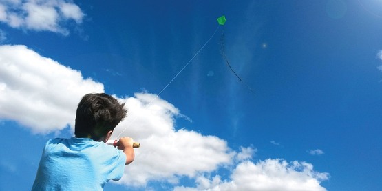 Youth flying a kite