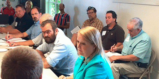 Several local growers, including Daniel Martin, Dr. John Dewar, Andy Maslin, Bob Washo, Dan Kent, Brian Bennett and Tim and Kathy Fuller, took part in a recent discussion on plans to roll out a far-to-school pilot program this coming school year. From left are Adirondack North Country Association Agriculture and Local Economies Director Josh Bakelaar; Assemblywoman Addie Russell; Daniel Martin, Martin's Foodstand; Dr. John Dewar, president of the North Country Grown Cooperative, Inc., Board of Directors; Patrick Ames, executive director of Cornell Cooperative Extension of St. Lawrence County; and John Warner of New York Farm Bureau. Back row: David Stark and Andy Maslin of 24:45 organics; Bob Washo of littleGrasse Foodworks and Daniel Kent of Kent Family Growers.