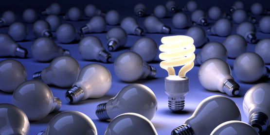 CFL lightbulb surrounded by incandescent bulbs (NOTE: this is used by CCE-Tompkins as the image for $ave Energy, Save Dollars workshops)