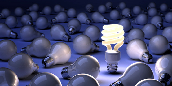 CFL lightbulb surrounded by incandescent bulbs (NOTE: this is used by CCE-Tompkins as the image for $ave Energy, Save Dollars workshops)