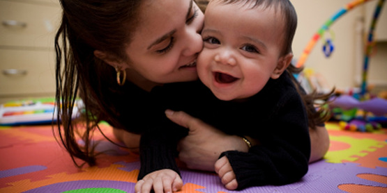 Mother playing with infant, for use with "Why do you parent the way you do" classes