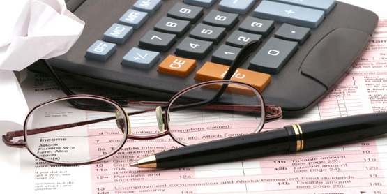 tax return, eye glasses, calculator