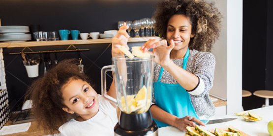 mother and daughter cooking