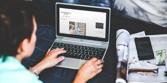 Laptop user with magazine