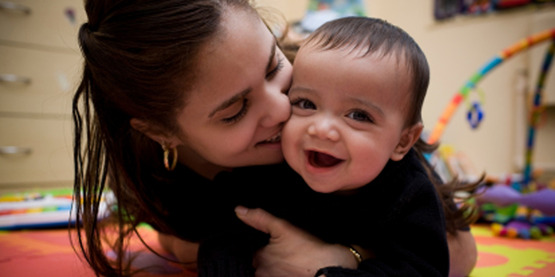 Mother playing with infant, for use with "Why do you parent the way you do" classes
