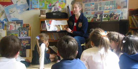 A volunteer reads to a group of 2nd graders in Tompkins County during Ag Literacy Week 2006. Ag-in-the-Classroom