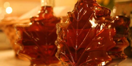 maple syrup in leaf-shaped glass bottles