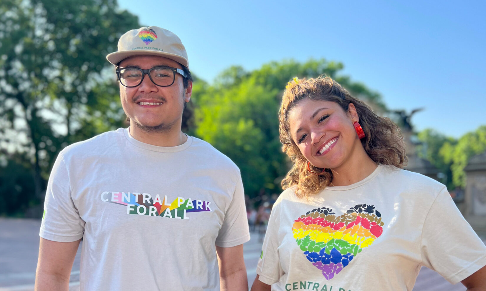 Two people wearing Central Park Pride t-shirts