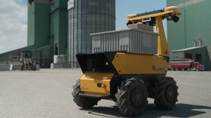 The Husky AMP Transporter configuration moving a bin of materials