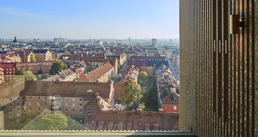 View of the facade system and of Stockholm from the balcony of OMA's Norra Tornen.