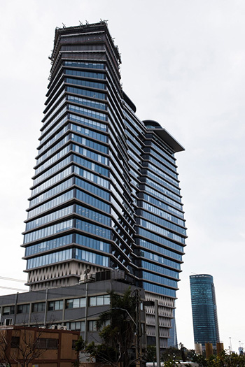 The twisted tower is narrow at the base but widens at the top. Photo source: Dezeen