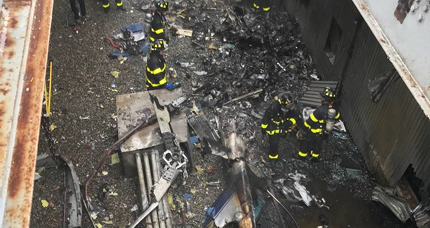 Firefighters inspect the site of the helicopter crash landing atop a New York City skyscraper. Image source: New York City Fire Department’s Twitter