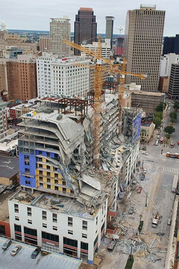 Several floors of the hotel toppled down amid blinding dust and flying debris while there are still fears of another collapse. Photo by Brandon Knox Photography LLC.