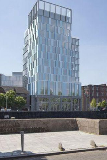 The development includes a 14-story apartment tower building at Bank Place close to the River Shannon.