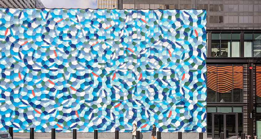 The Atmospheric wave wall is a public art installation spanning 9.1 by 18.2 meters.