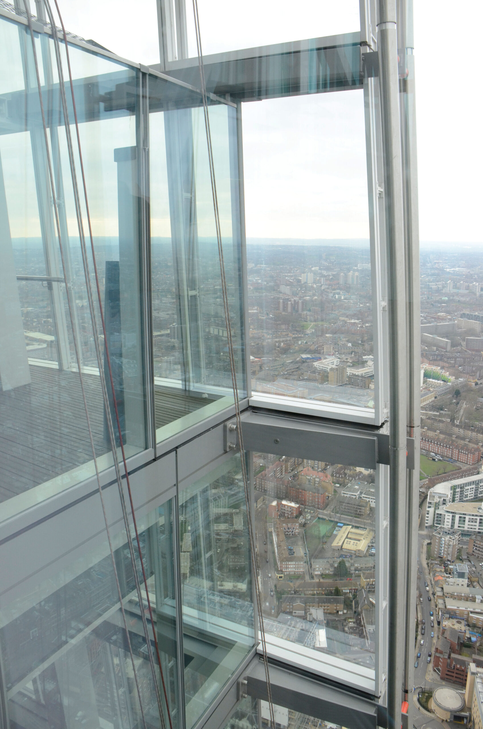 Figure 12. While architecturally very integral to this iconic tower, the glazed curtain wall extensions at the Shard, London (2013, observatory at 244.3 m) impede the view and create additional reflections.