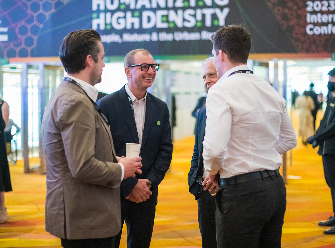 Four people conversing at a convention