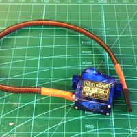 Putting wire mash guard on a servo lead | Flite Test