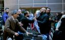 Palestinian activists disrupt a meeting between members of an American economic delegation and the Head of the Bethlehem Chamber for Commerce and Industry in the West Bank town of Bethlehem on January 30, 2018.