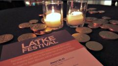 Hanukkah gelt glimmers on a table at the 8th-annual Latke Festival, which was held at the Brooklyn Museum.