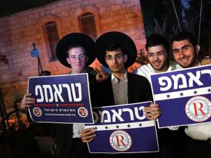 Jewish supporters of US republican presidential candidate Donald Trump hold placards in Hebrew showing support to their candidate during a pre-US elections rally organized by The Republican Overseas in Jerusalem.