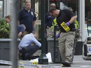Shooting Probe: Police investigate the aftermath of deadly shooting outside Empire State Building in Manhattan.