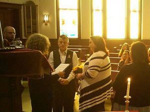 ‘Sacred Space’ Sun streams in through the windows as a couple says their vows at Temple B’nai Sholom.