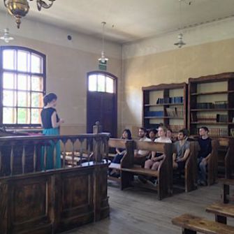 New Life: Emily Herlyn (left) gives a tour of the Oświęcim synagogue.