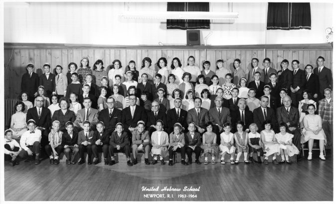 Vibrant: Newport's United Hebrew School poses for its 1963-'64 portrait. Rabbi Theodore Lewis, a towering presence for almost four decades, is seated fifth from left in the second row from the front.